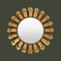Modern sunburst wall mirror featuring brushed gold petal accents and a round reflective centre.