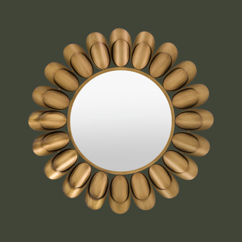Modern sunburst wall mirror featuring brushed gold petal accents and a round reflective centre.