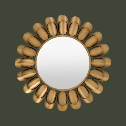 Luxury round mirror with decorative gold floral-inspired frame and minimalist design.