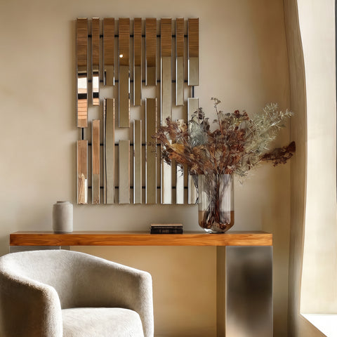 Modern interior with a decorative mirror, wooden console table, and chair.
