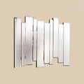 Contemporary geometric mirror decor with layered vertical panels on a neutral background.