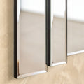 Detailed view of contemporary mirrored wall art with beveled edges and layered vertical panels.