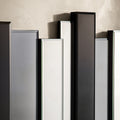 Detailed view of contemporary wall decor with alternating mirrored and black vertical panels.