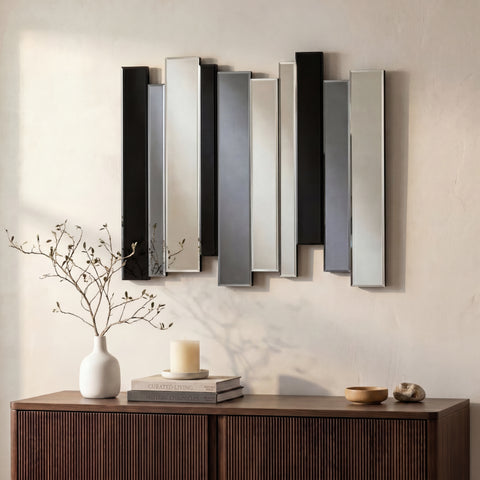 Abstract mirrored wall installation with layered vertical panels in a warm modern interior.