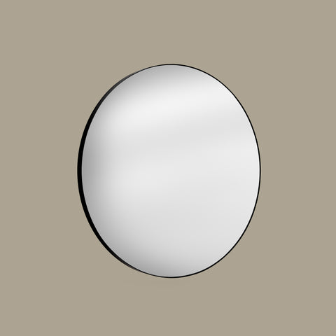 Round mirror with black frame on a beige background