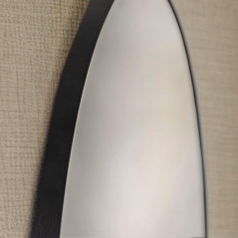 Close-up of a round black framed mirror