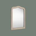 Decorative grey wall mirror with a softly curved silhouette, distressed finish and delicate beaded detailing.