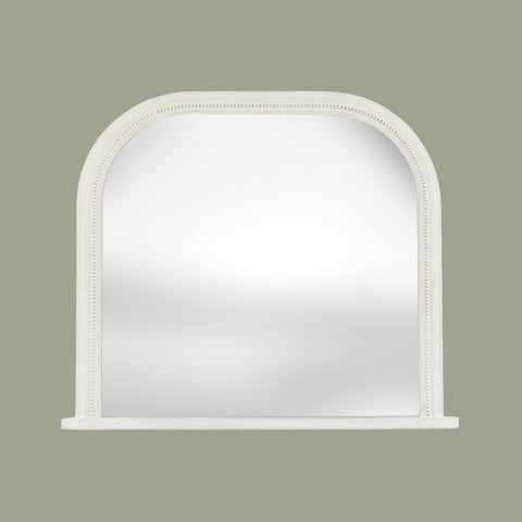 White arched wall mirror with a subtly distressed finish and delicate beaded detailing around the frame.