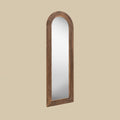 Tall arched wooden leaner mirror featuring a warm dark oak-look frame with textured grain detailing for an elegant rustic finish.