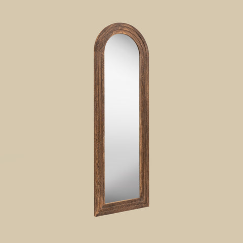 Tall arched wooden leaner mirror featuring a warm dark oak-look frame with textured grain detailing for an elegant rustic finish.