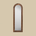 Rustic arched leaner mirror in a richly textured dark wood finish.