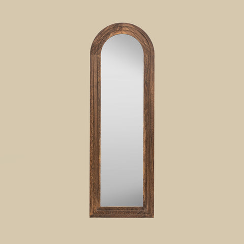 Rustic arched leaner mirror in a richly textured dark wood finish.