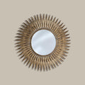 Sunburst wall mirror with a textured gold finish.