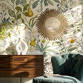 Decorative gold mirror with radiating sunburst detailing, styled in a characterful interior to add warmth and refined elegance.