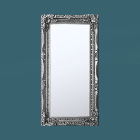 Vintage-style full-length leaner mirror with intricate silver baroque detailing and elegant styling.