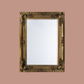 Decorative baroque-inspired mirror with an ornate gold frame and classic timeless styling.