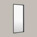 Rectangular Large leaner mirror with black frame on a grey background