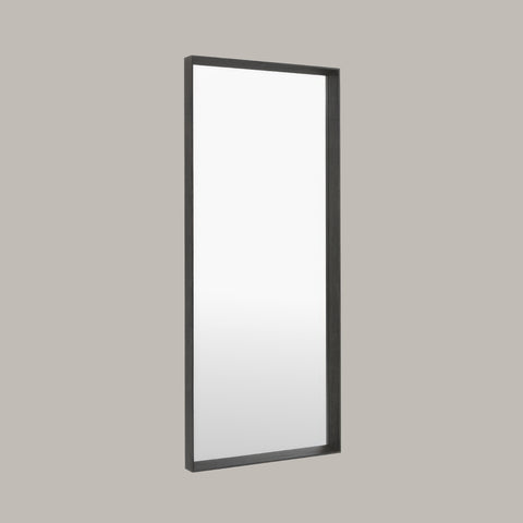Rectangular Large leaner mirror with black frame on a grey background