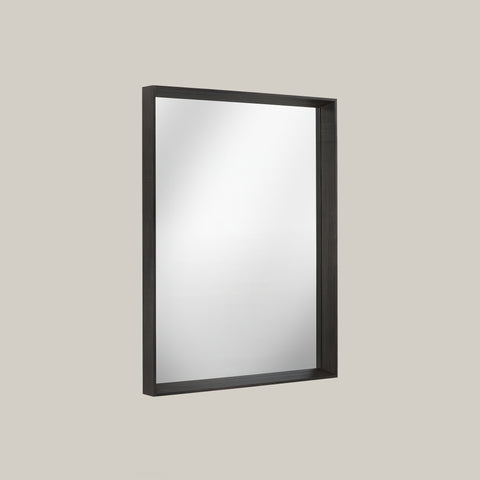 Rectangular mirror with black frame on a light gray background