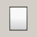 Black-framed mirror on a gray background
