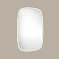 Irregular rounded rectangular wall mirror with a slim white frame and soft organic modern design against a neutral background.