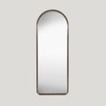 Large arched walnut mirror on a soft grey background