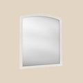 White wood framed over-mantel mirror angled on a beige wall