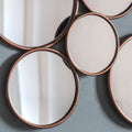 Close up bronze multi-circle wall mirror with overlapping round mirrors