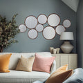 A striking multi-circle wall mirror designed to create impact, this contemporary statement piece will add visual interest to living rooms, hallways and dining spaces.