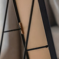 close up of the back of a black framed cheval mirror