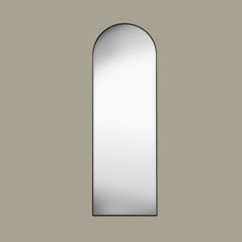 Black arch cheval mirror face on set in a  beige background