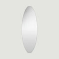 Slim oval mirror with softly curved edges, designed to bring light, simplicity and subtle elegance to modern interiors.