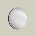 Contemporary round wall mirror with a slim dark frame, offering clean lines and understated modern elegance.