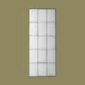 Vertical industrial-style wall mirror with antiqued glass panels and geometric black metal framing.