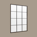 Contemporary black framed wall mirror with twelve-panel grid detailing and minimalist styling.