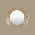 Textured round mirror with layered organic ridges and softly aged metallic tones, designed to create warmth and decorative depth.