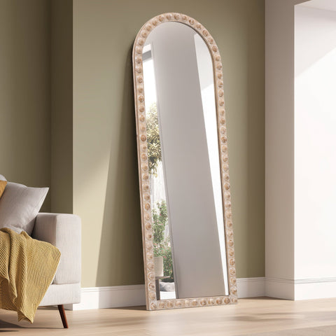 Rowan arch leaner mirror in bedroom with wooden bobble frame detail