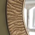 Serrano round mirror close-up showing textured gold frame detail