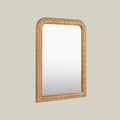 Gold-framed mirror with ornate carved detailing, designed to bring classic character and timeless elegance to interiors.