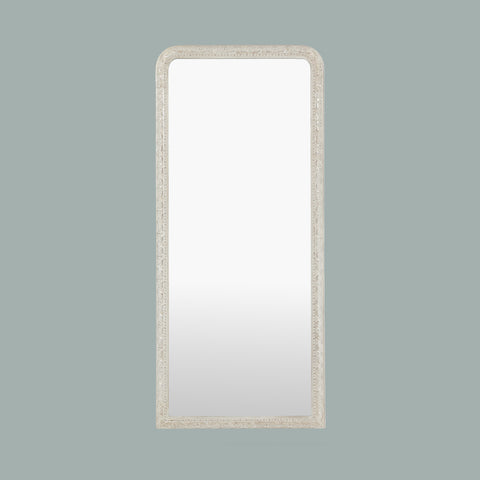 Elegant leaner mirror with a decorative gold frame, highlighting intricate carved patterns and a refined traditional finish.