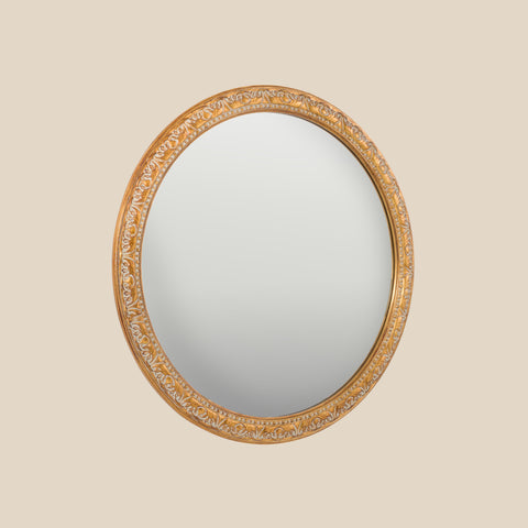Vintage-inspired oval wall mirror showcasing ornate gold detailing and refined classical styling.