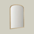 Elegant arched mirror with delicate beaded detailing.