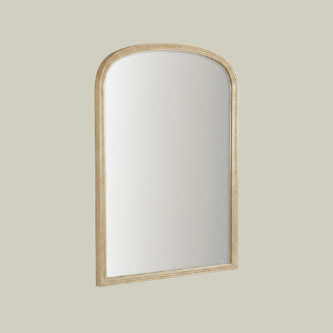 Elegant arched mirror with delicate beaded detailing.